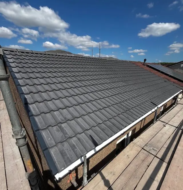 Completed anthracite tiled roof photographed from the ridge